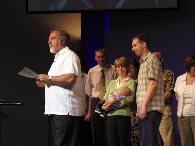 Aidan & his family with Pastor Barry